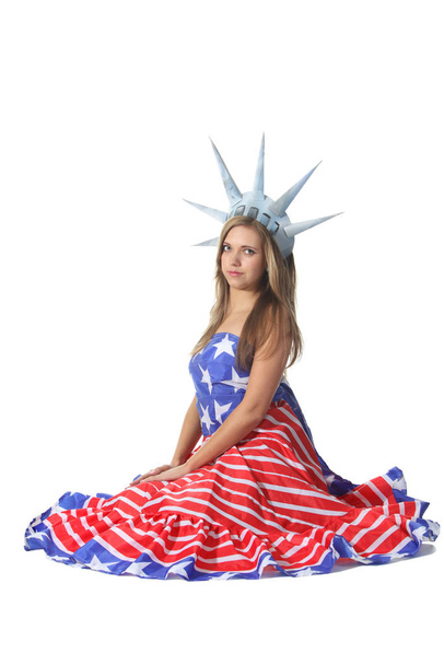Attractive blond woman in costume Statue of Liberty - Foto, afbeelding
