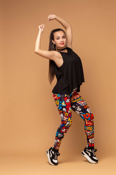 Modern style dancer posing on studio background - Фото, изображение