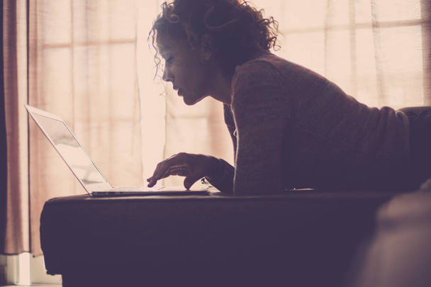 Young woman at home working on laptop  - Fotó, kép