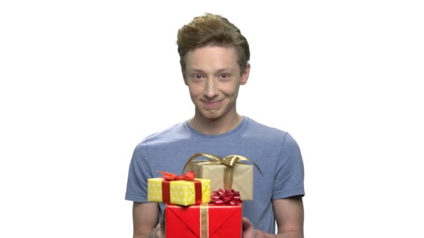 Cute funny guy giving gift boxes. - Footage, Video