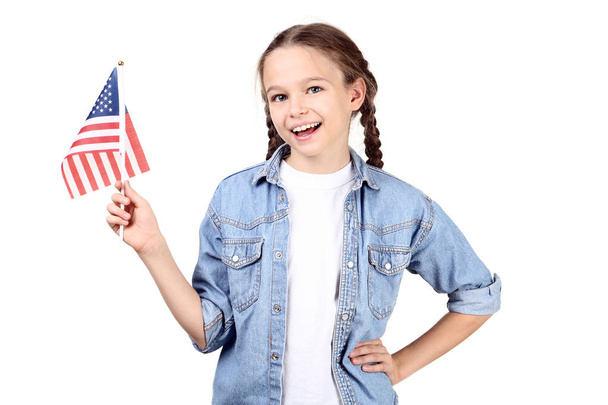 Young girl holding an American flag on white background - Φωτογραφία, εικόνα