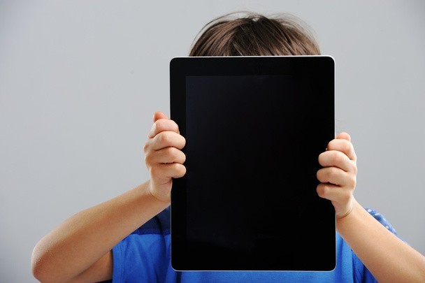 Cute little boy with Tablet PC - Foto, afbeelding