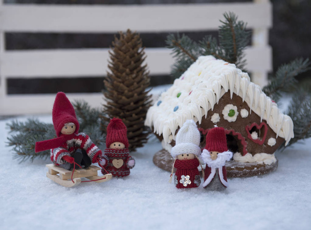 Christmas composition with gingerbread house, toys and cone - Φωτογραφία, εικόνα
