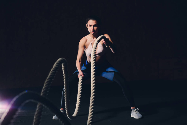 beautiful athletic woman working out with ropes box gym copyspace confidence motivation sports lifestyle activity hobby healthy powerful femininity training. - Photo, image