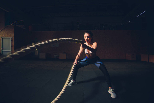 beautiful athletic woman working out with ropes box gym copyspace confidence motivation sports lifestyle activity hobby healthy powerful femininity training. - Valokuva, kuva