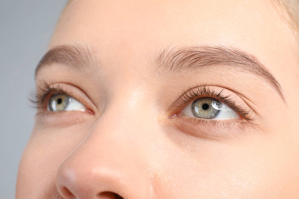 Young woman with beautiful natural eyelashes, closeup - Photo, Image