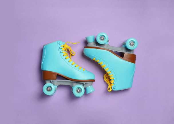 Pair of stylish quad roller skates on color background, top view - Foto, Imagem