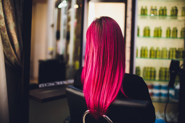 Painting red of hair in a beauty salon. - Photo, image