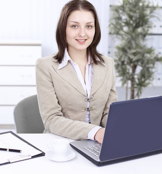 Executive business woman sitting at her Desk - Photo, image