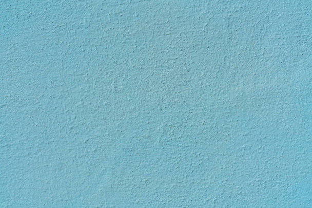 Plastered concrete wall, painted in blue, surface texture. - Photo, Image