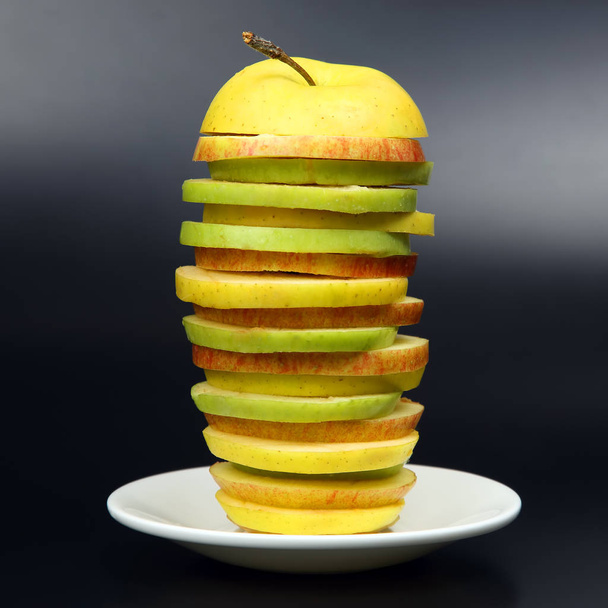 Sliced apple on white plate - Fotoğraf, Görsel