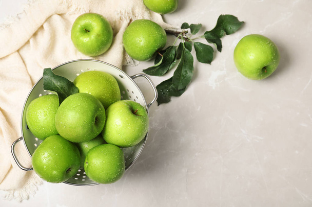 Composition with juicy green apples and space for text on table, top view - Photo, image