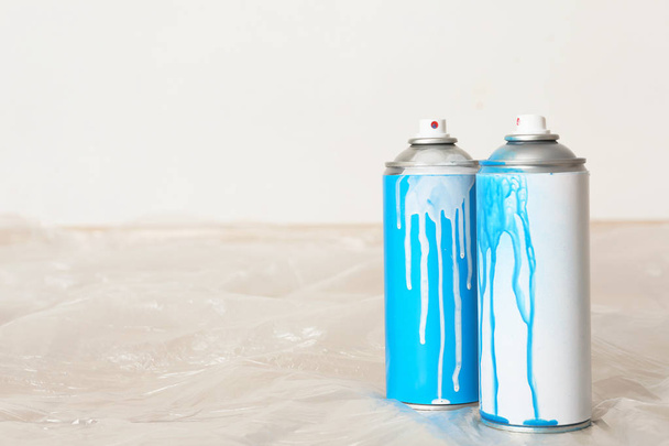 Used cans of spray paint indoors. Space for text - Foto, Bild