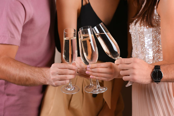 Friends clinking glasses with champagne, closeup. Party time - Foto, imagen