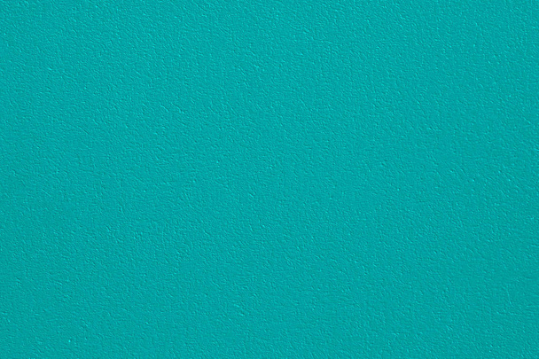 Plastered concrete wall, painted in emerald color, surface texture in high resolution. - Fotó, kép
