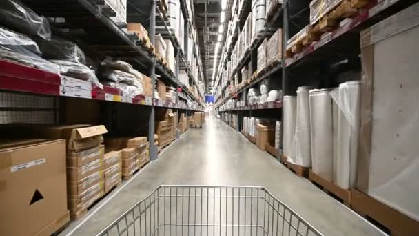 4k Market cart moves in huge industrial warehouse - Felvétel, videó