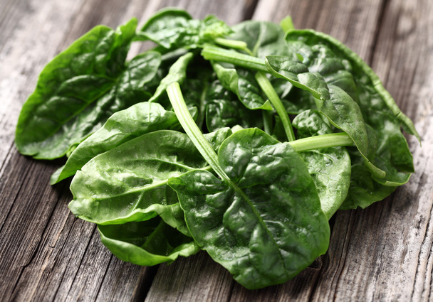 Spinach on a wooden background - Photo, image