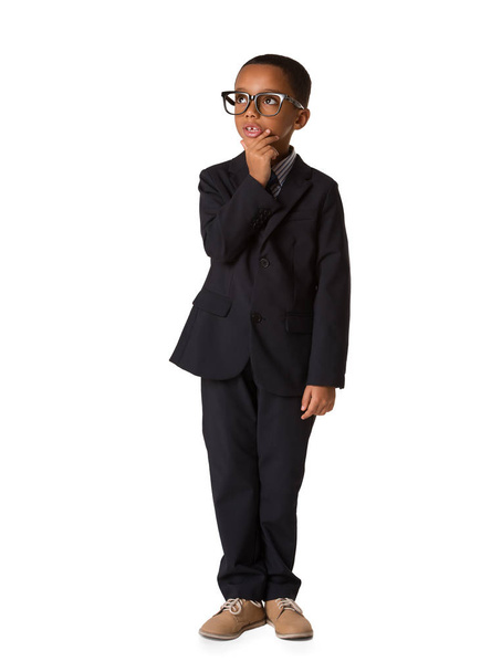 Elegant little thoughtful boy with glasses in business suit. Studio shot. Young boy posing, Full length body - Valokuva, kuva
