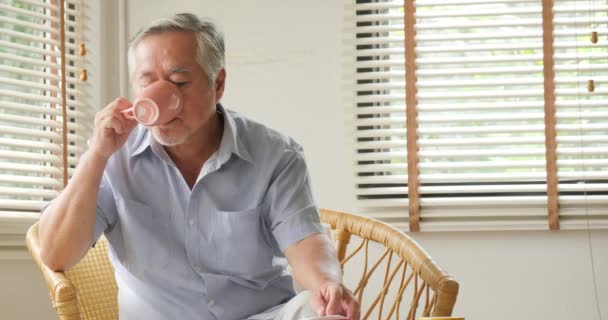 Asian senior man was massaged by his wife at home. - Filmagem, Vídeo