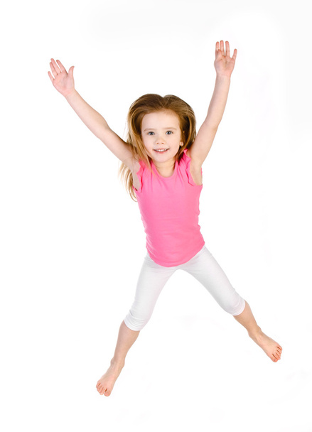 Adorable little girl jumping in air isolated - Zdjęcie, obraz