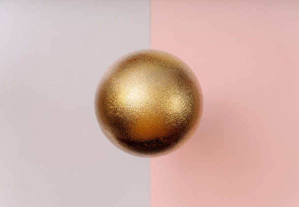 Patrón de bola de Navidad dorada sobre fondo rosa y gris
 - Foto, imagen