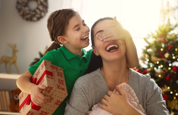 mom and daughter exchanging gifts - 写真・画像