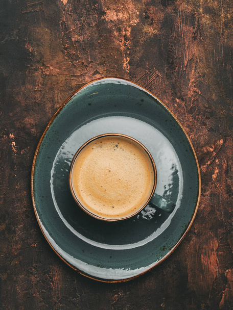 Top view of cup of espresso on dark copper background  - Foto, imagen