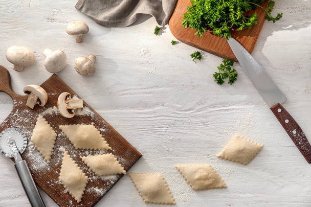 Flat lay composition with tasty ravioli on white table - Photo, Image