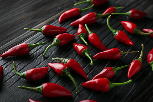 Red hot chili peppers on wooden background - Photo, Image