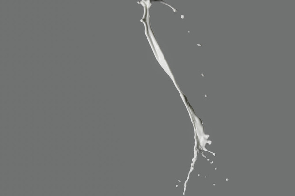 Splash of milk on grey background - Foto, afbeelding