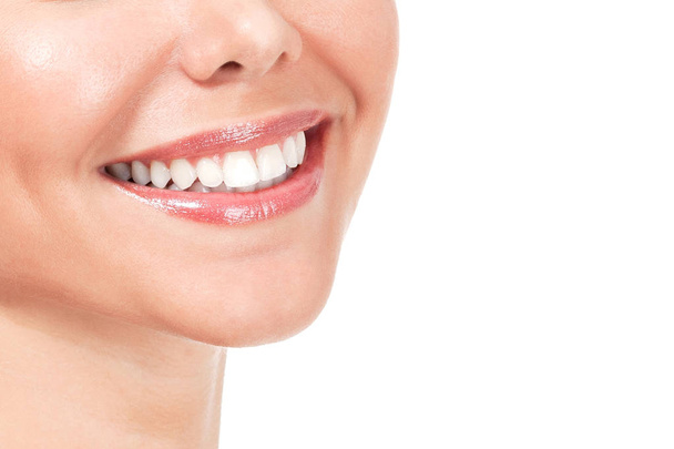 Closeup shot of beautiful female smile, isolated on white background - Photo, Image