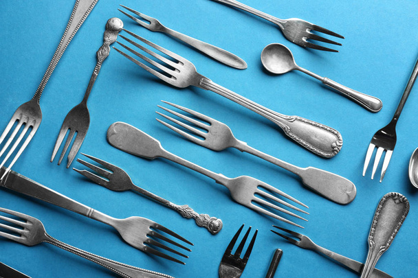 Silver cutlery on colour background - Photo, Image