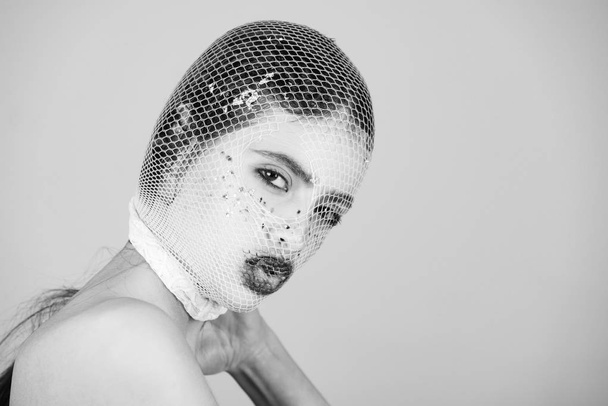 young woman with face in stylish fishnet stocking - Φωτογραφία, εικόνα