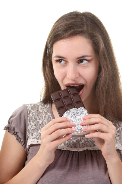 Young attractive woman eating  chocolate - Foto, afbeelding