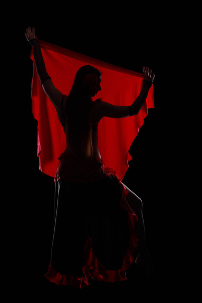 Attractive woman dancing in the darkness - Φωτογραφία, εικόνα
