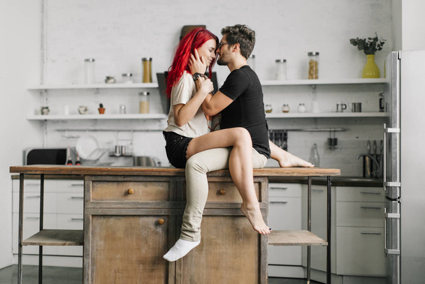  beautiful loving couple in the kitchen - 写真・画像