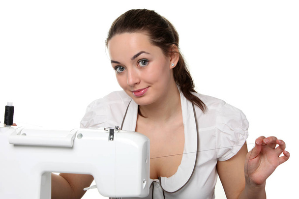 Woman seamstress working  on the sewing-machine - Φωτογραφία, εικόνα