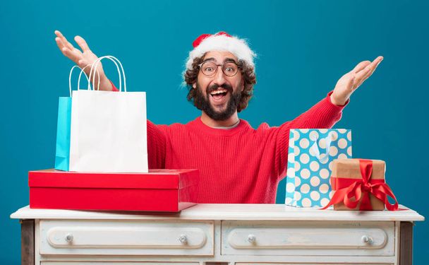 Young man with gifts. Christmas concept. - Фото, изображение