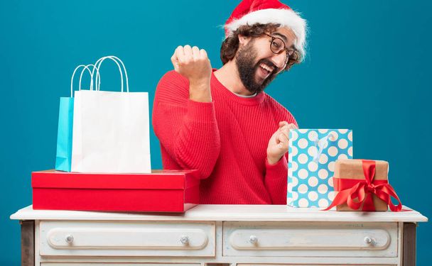 Young man with gifts. Christmas concept. - Φωτογραφία, εικόνα