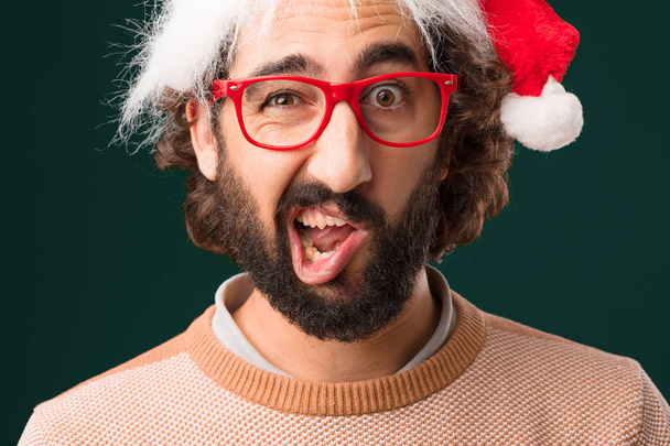 young crazy man with Christmas concept - Foto, Imagen