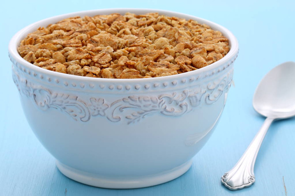 Delicious and nutritious lightly toasted breakfast muesli or granola cereal on vintage styling. - Photo, Image