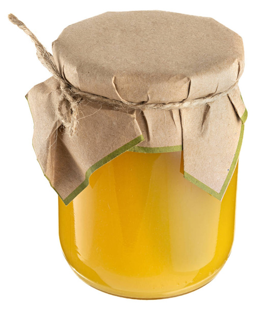 Honey jar with craft paper cap isolated on white - Fotoğraf, Görsel