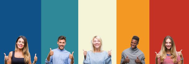 Collage of group of young people over colorful vintage isolated background success sign doing positive gesture with hand, thumbs up smiling and happy. Looking at the camera with cheerful expression, winner gesture. - Photo, Image