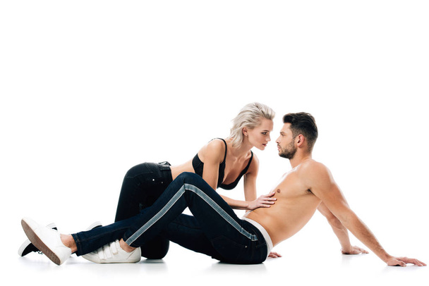 Sexy woman gently touching shirtless man isolated on white - Photo, Image