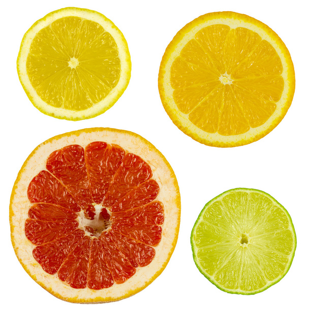 Slices of citrus fruits on white - Photo, Image