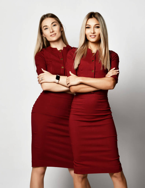 Two young beautiful european makeup artists friends or girlfriends women in dresses - Fotografie, Obrázek