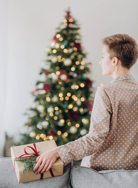 girl in pajamas celebration christmas a glass of champagne with gift boxes decor christmas tree - 写真・画像