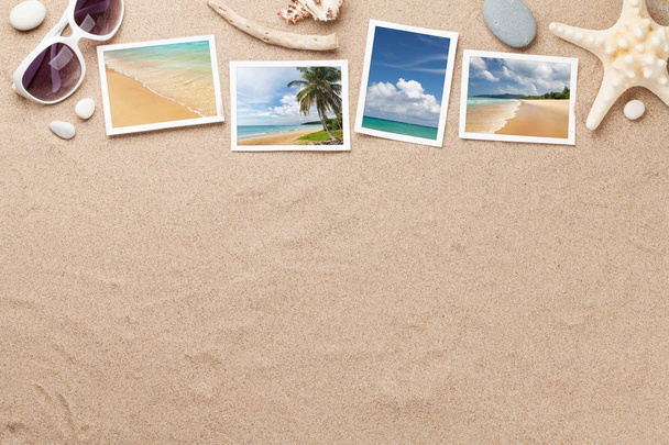 Voyage vacances concept de fond avec des lunettes de soleil, coquillages et des photos sur fond de sable. Vue supérieure avec espace de copie. Pose plate. Toutes les photos prises par moi
 - Photo, image