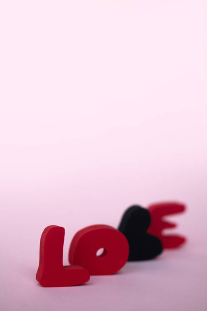 Valentines day greeting card with love word over blackboard. With space for your greetings. - Фото, зображення