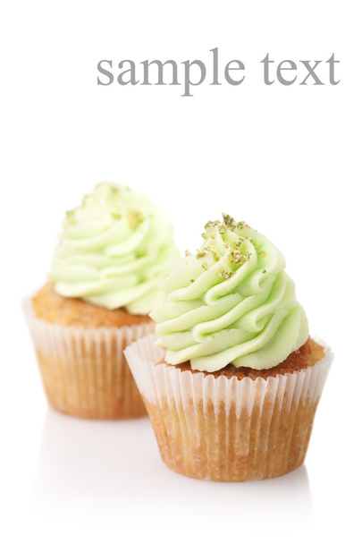 two cupcakes with green cream isolated on white background with - Photo, Image